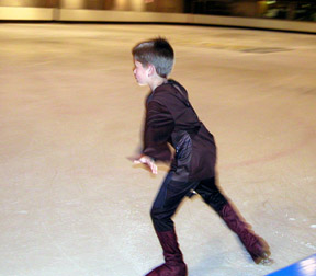 Mitchell skating as Luke Skywalker, leaning forward in a strong stroking posture
