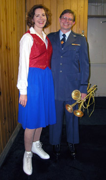 Couples skaters posing in costume