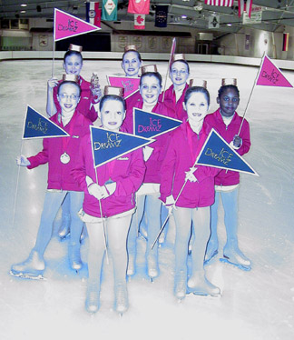 Synchro Ice Dream team posing with flags