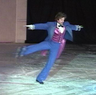 Drosselmyer skating, coming out of a spin with one leg extended