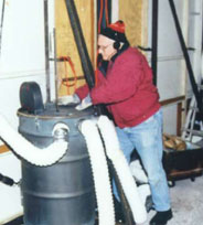 Gregory is working with a barrel that is connected by hoses
