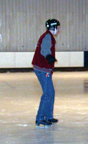 A skater balances on the ice