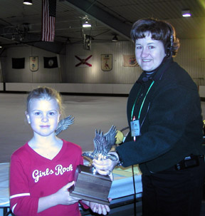 Shawnda and skater hold the first place trophy