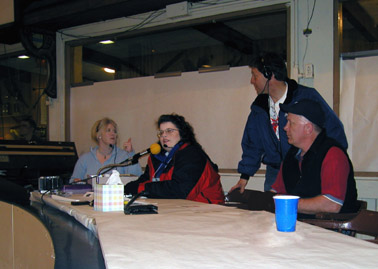 four announcers in the booth