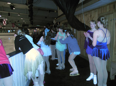 Skaters waiting to go on in the chaperone area