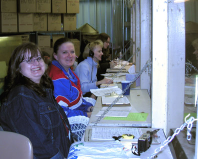 Timer Wendy and 3 judges in the booth
