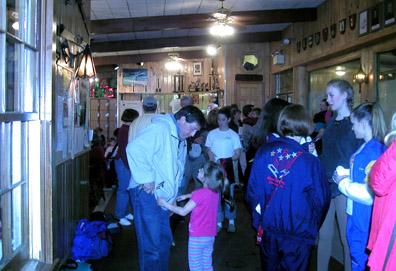 Larry talking to a child in the lobby