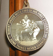 Medal of Robert Unger and his first students, they are both monkeys