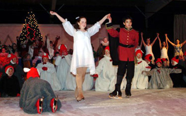 Clara and Prince at their closing bow, with rats on the ice on their knees around them