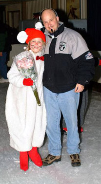 A rat skater holding her flowers standing with her dad