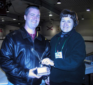 Point Mallard coach accepting sportsmanship trophy