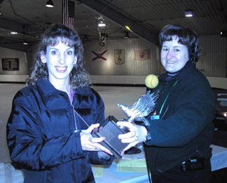 Coach accepting third place trophy